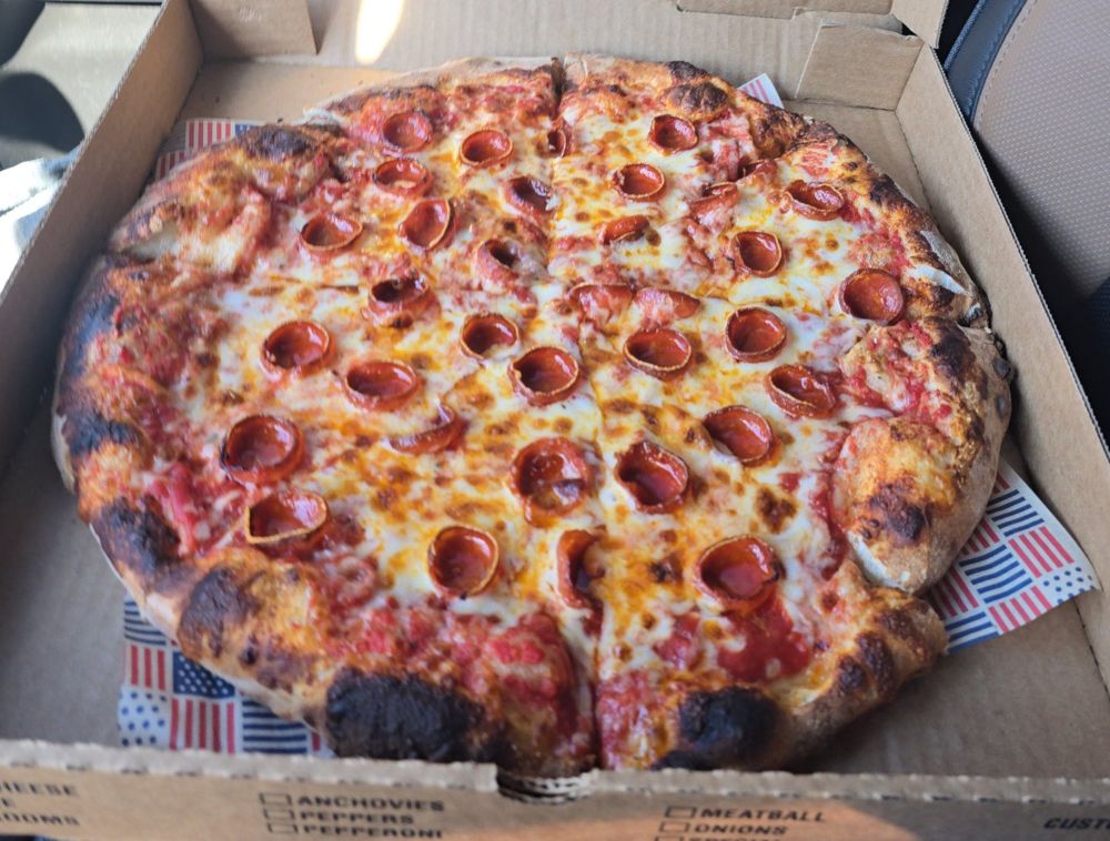 Wood-fired pepperoni pizza cooked with KIR Pizza Wood